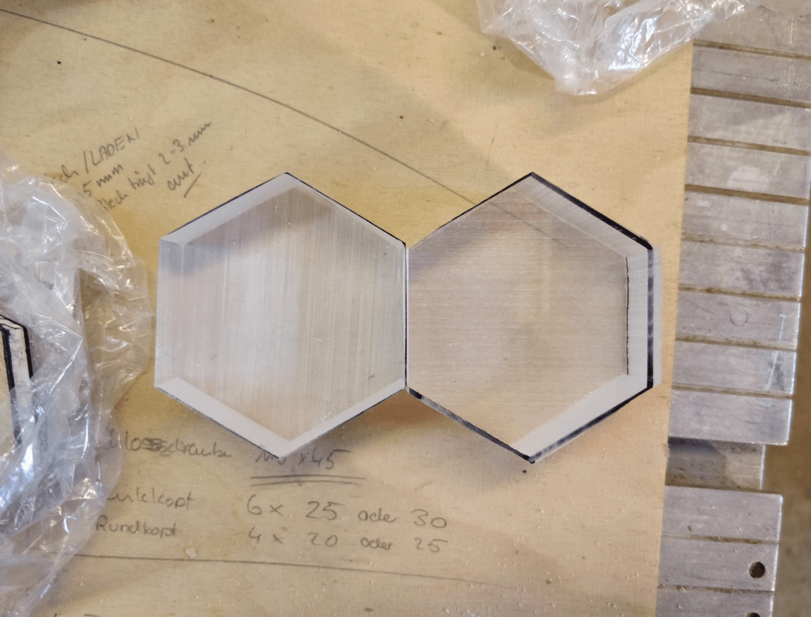 Wooden and acrylic hexagon modules arranged during fabrication