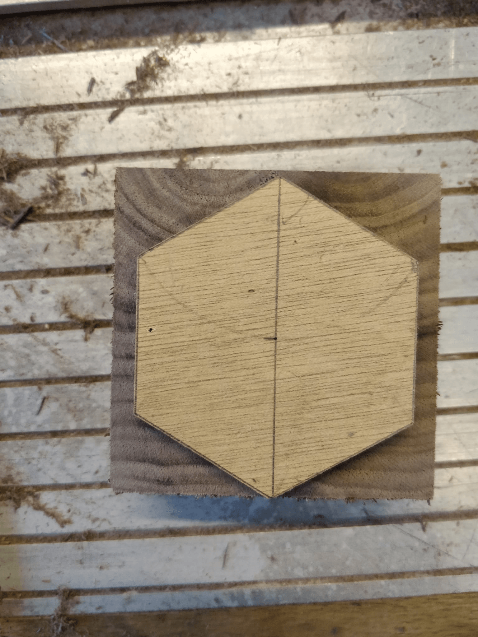 Close-up of translucent acrylic and walnut hexagon pieces