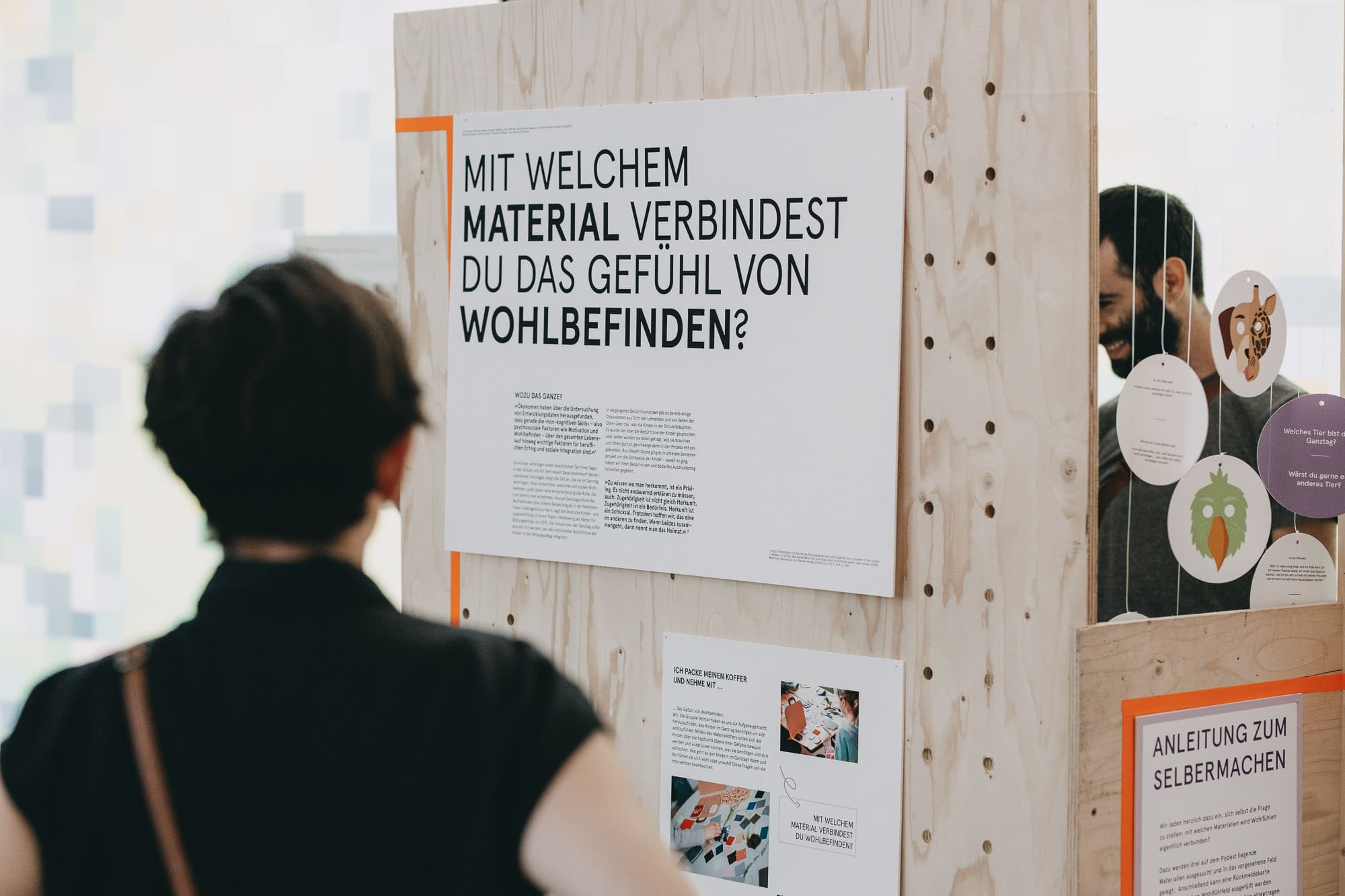 Visitor viewing an exhibition panel