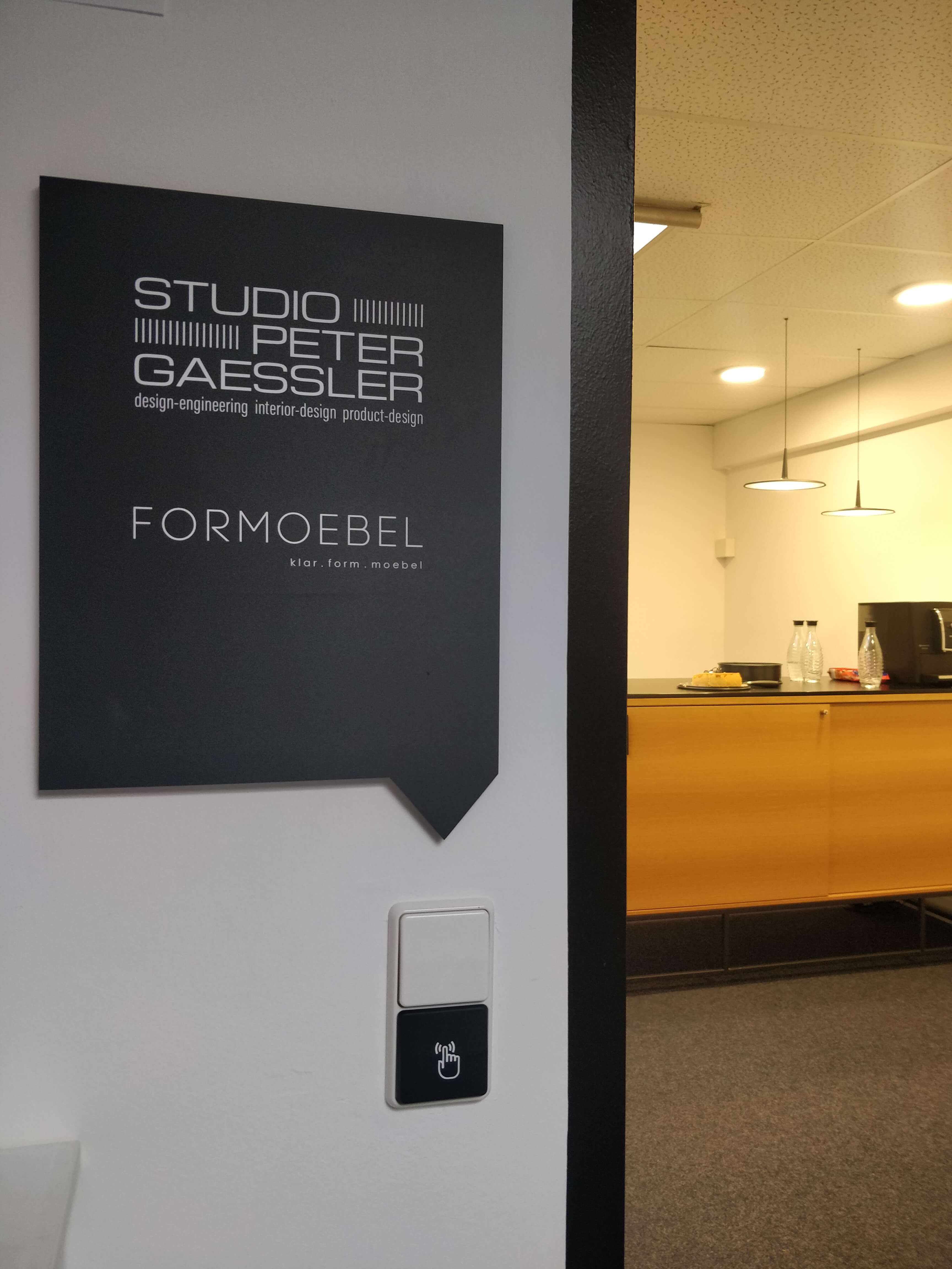 SPG business card photographed in hand